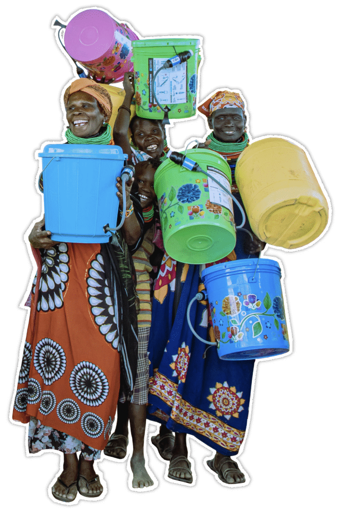 Smiling women holding colorful water buckets equipped with filters provided by The Bucket Ministry